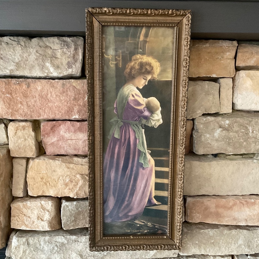 Antique mother holding baby picture